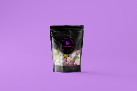 Black pouch with colorful candies on a purple background